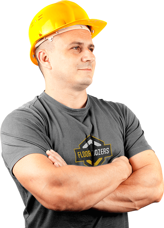 Image of a man, wearing Floor Dozers branded clothing, with crossed arms looking proudly toward a brighter future